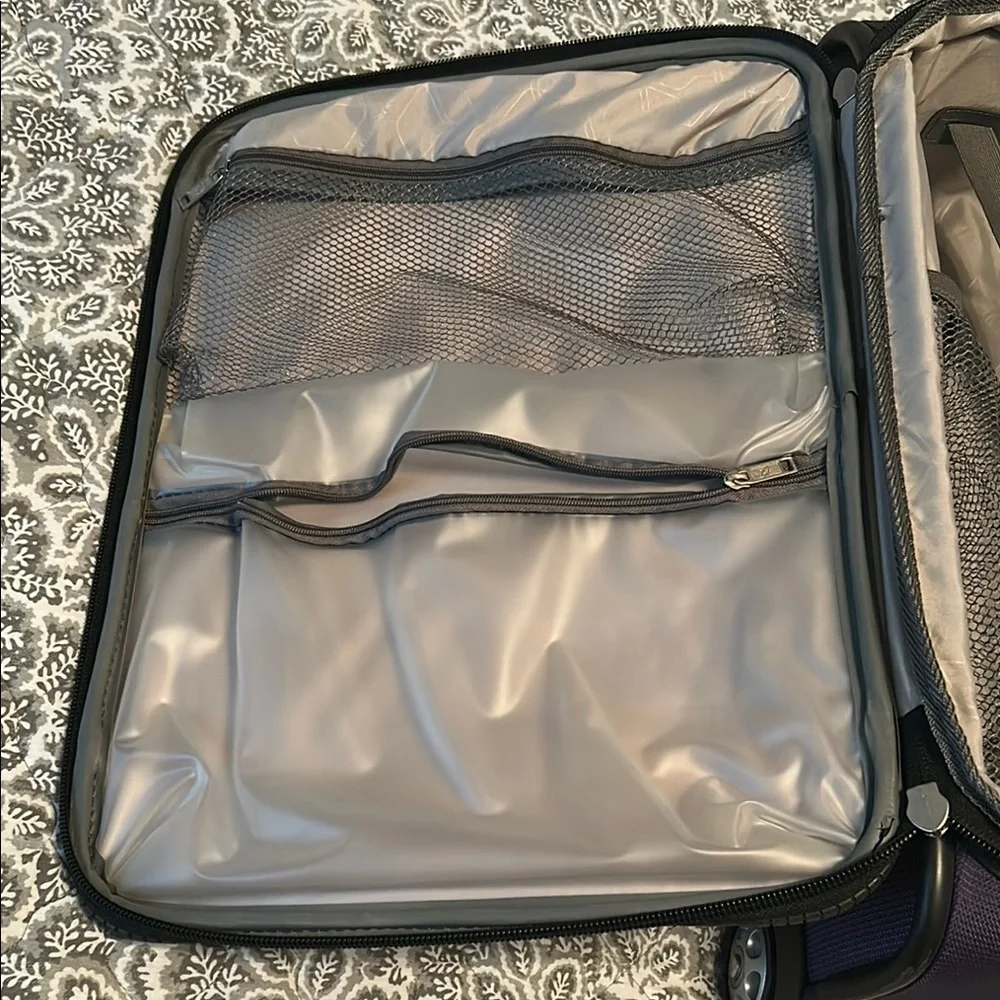 American Tourister Purple Carry-On Rolling Suitcase